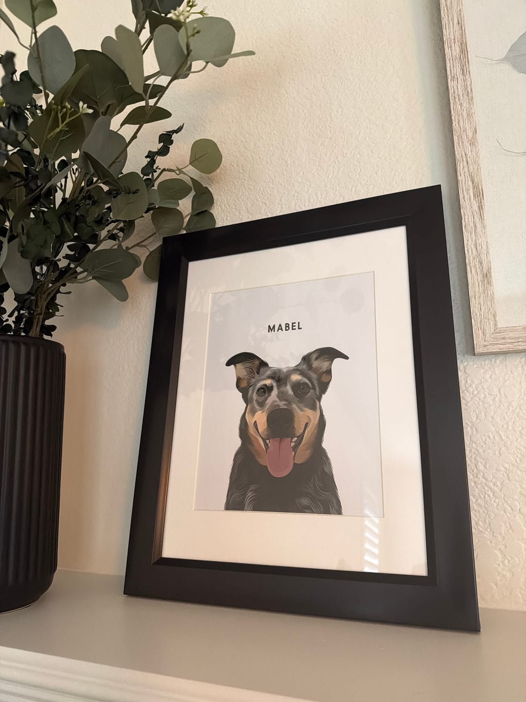 Black-framed custom portrait of a smiling black and tan dog named Mabel