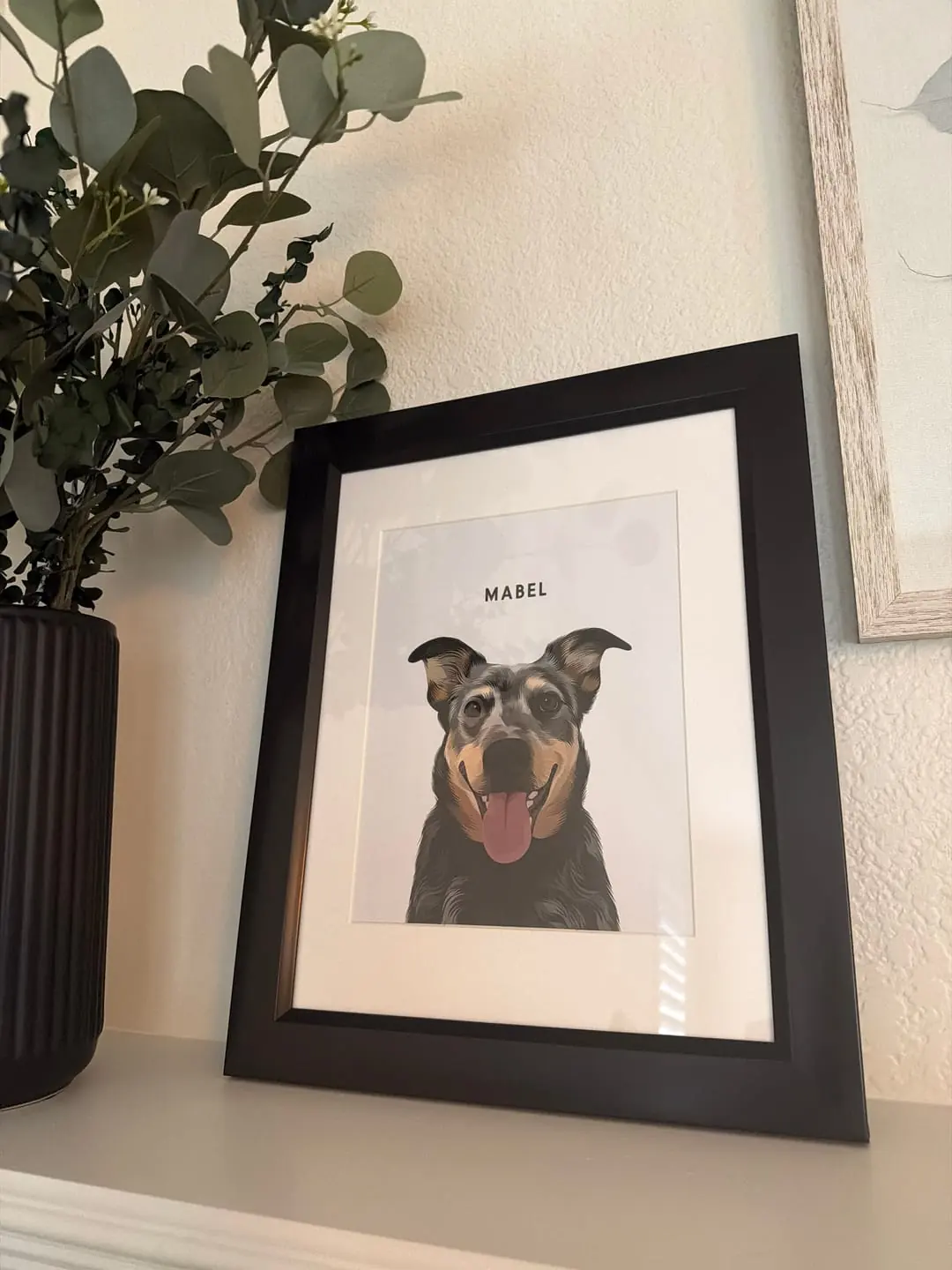 Black-framed custom portrait of a smiling black and tan dog named Mabel